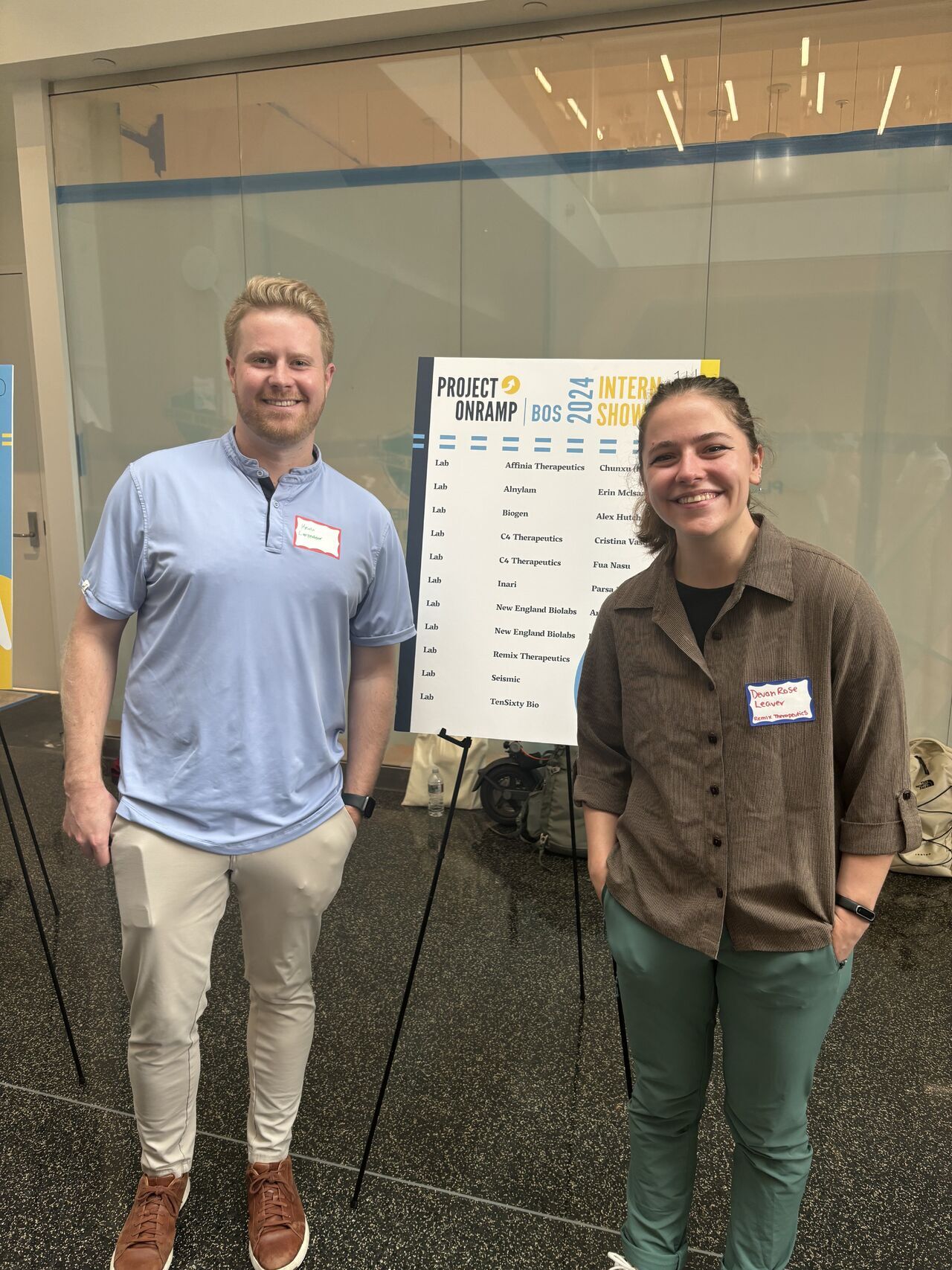 Devon Rose Leaver and a colleague at a conference during her  internship in a biomolecular and science lab at Remix Therapeutics
