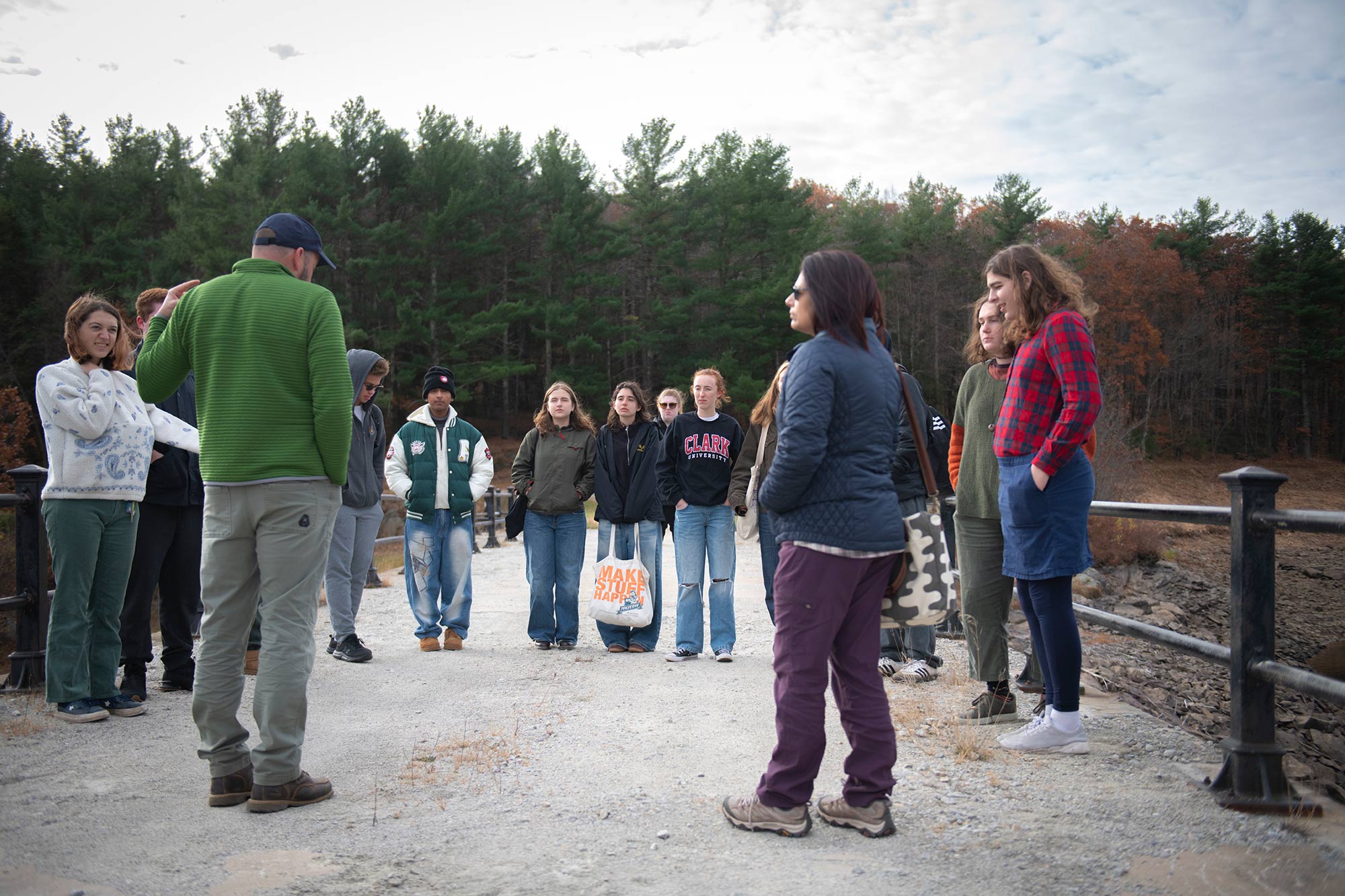 Students gathering at a reservoir for a course on water in the city.