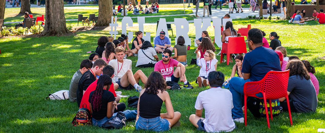 Students sitting on green