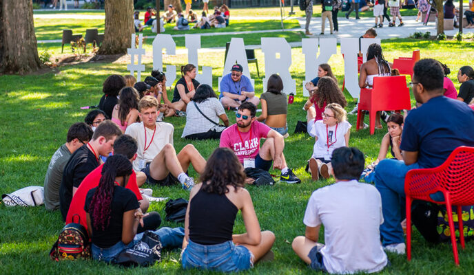 Students sitting on green