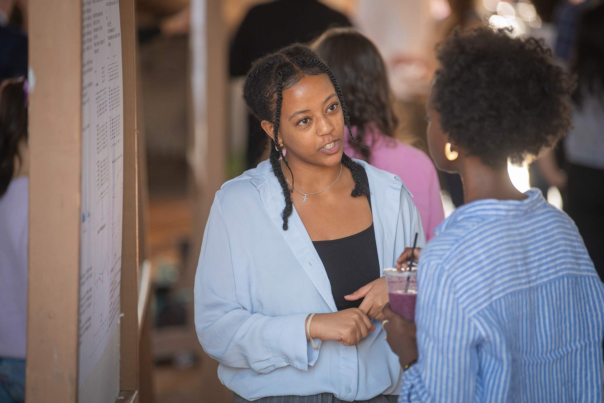 A student presenting research at a ClarkFest research showcase