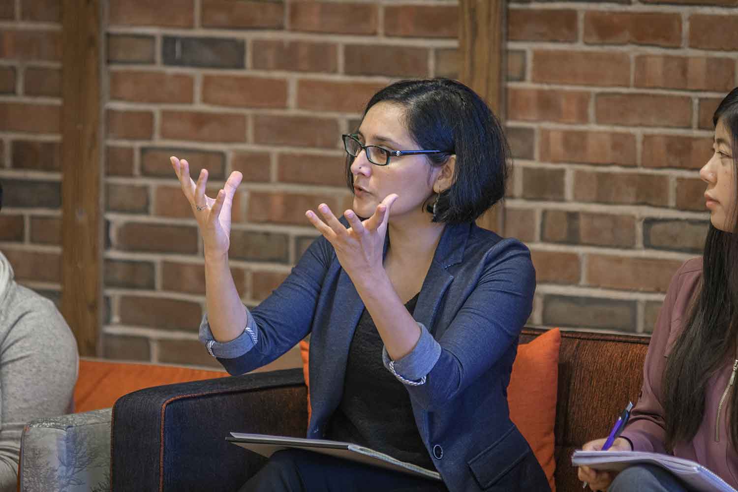 Gohar Siddiqui, a participant in the Faculty Brown Bag Series, engaging in a discussion