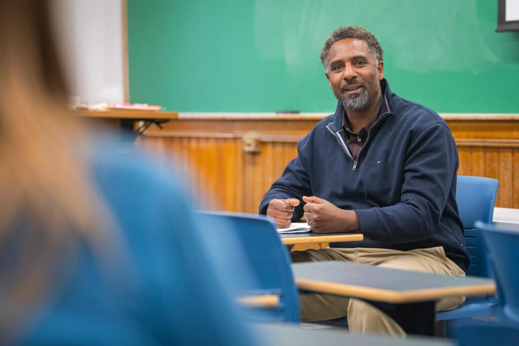 Ousmane Power Greene leading a class discussion in the History of Hip Hop class