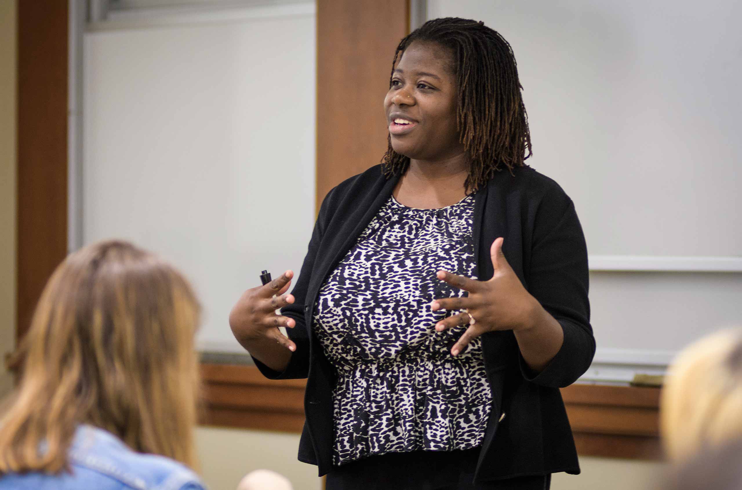 Professor Nicole Overstreet delivering a lecture in an gender and women's studies class