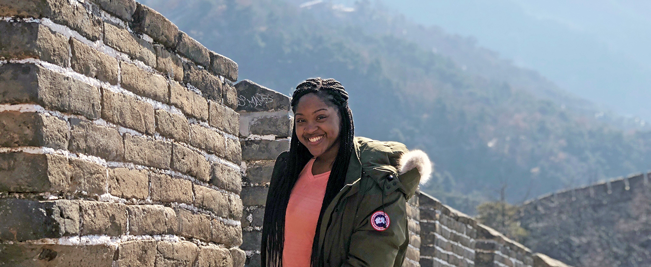 A Clark student at the Great Wall of China