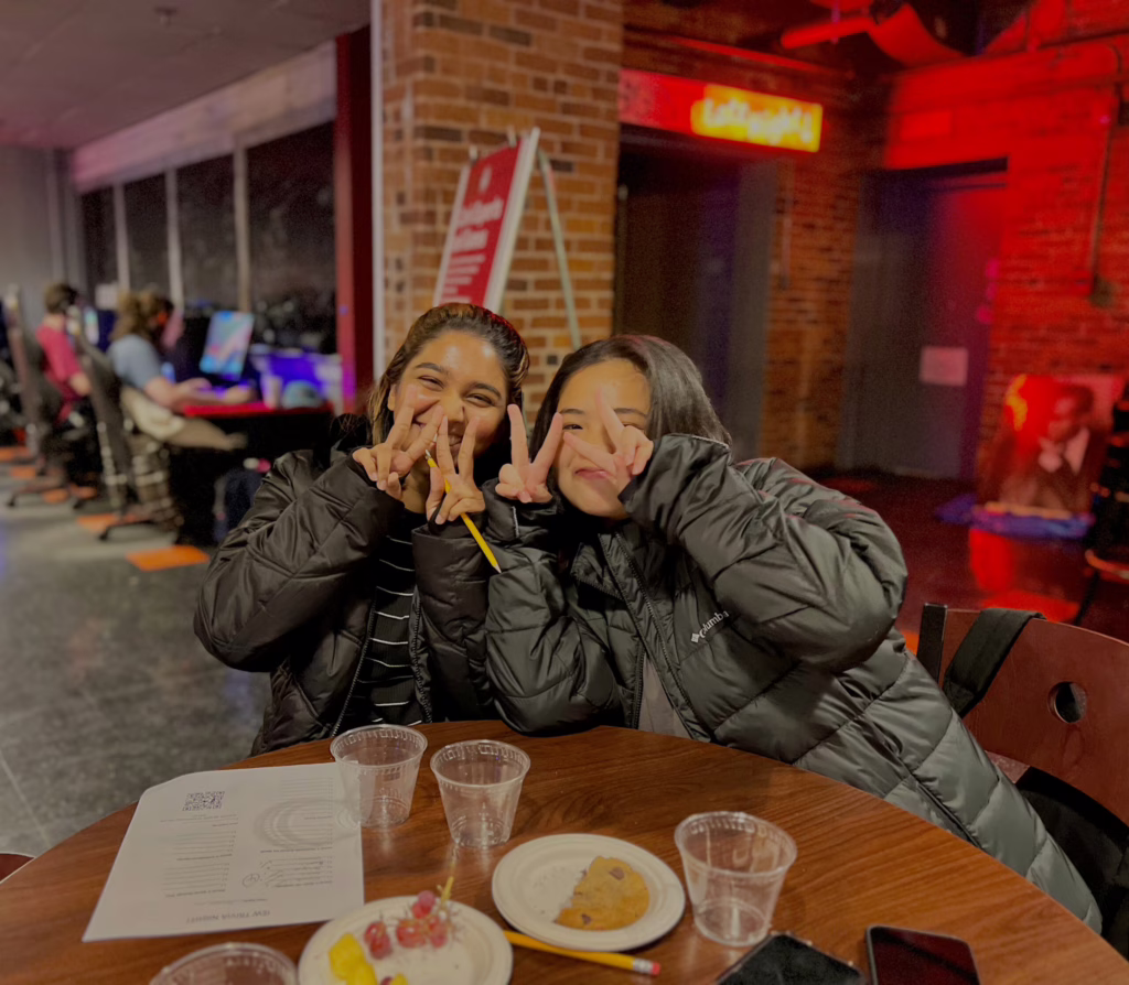 female students doing peace signs