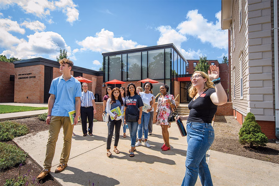 Student giving campus tour to prospective students at Clark