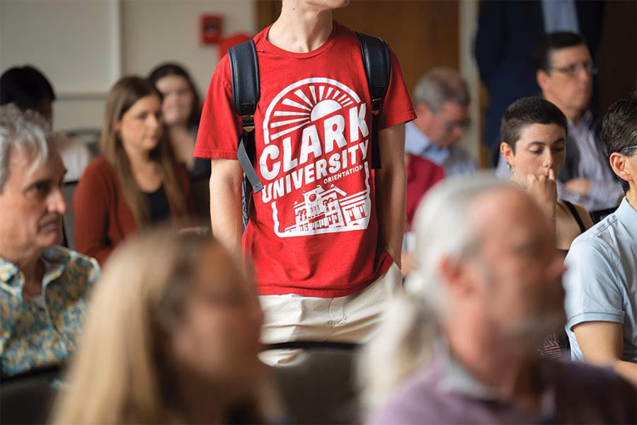 Student with Clark University orientation t-shirt