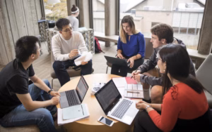 mba students sitting around desk