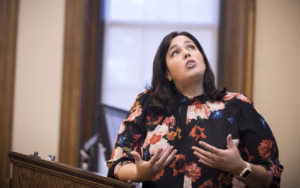 a student gives an address from a podium