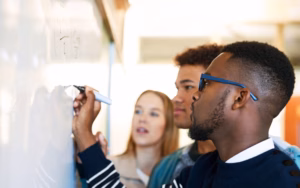 Mathematics Education students writting on whiteboard