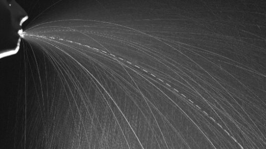 an artificial sneeze machine emits a fine mist
