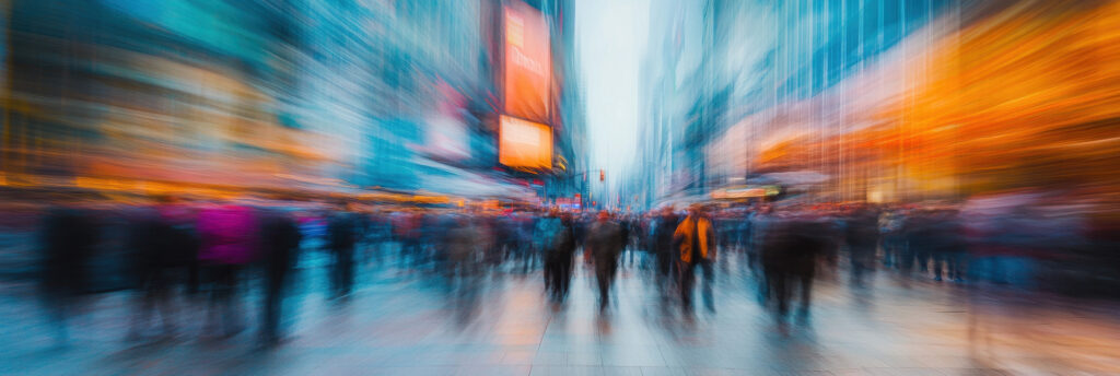 blurred image of people in times square, ny