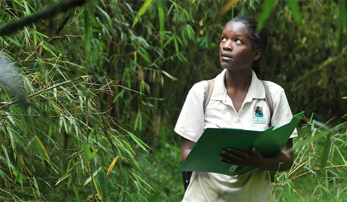 bernadette arakwiye in grass