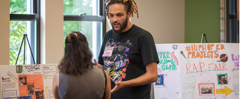 young teacher talking to another teacher