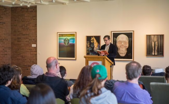 students and professors listening into a discussion