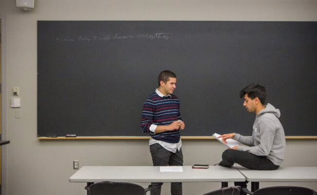 students at chalk board