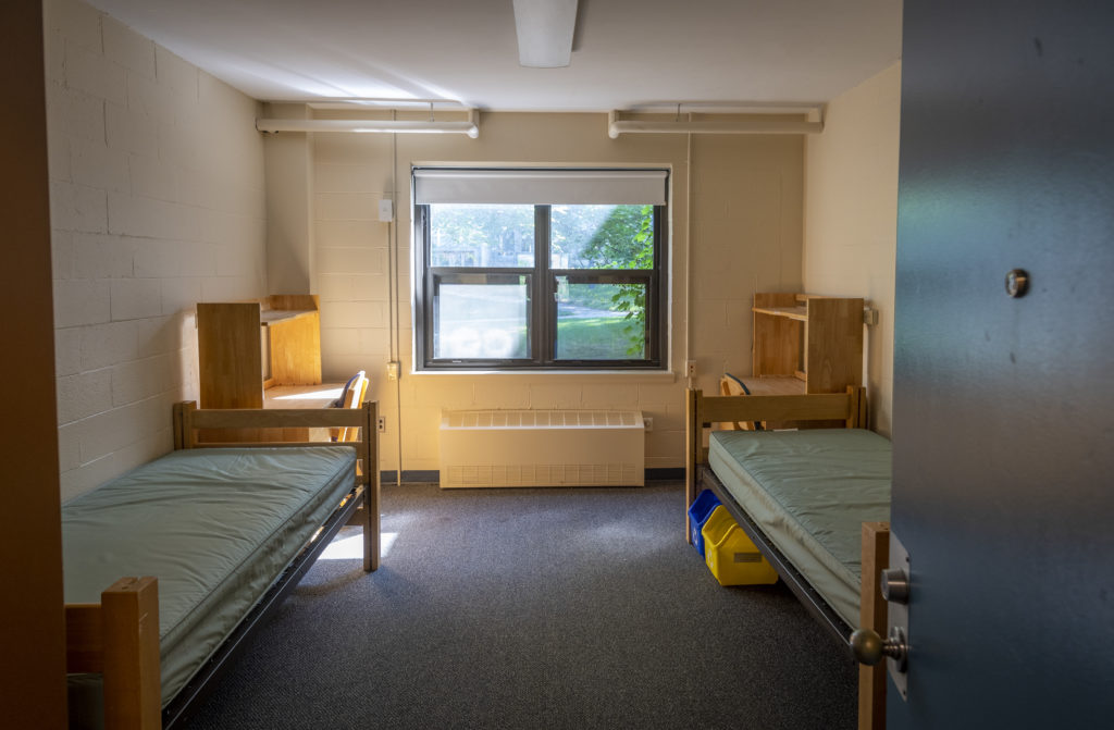 dorm room setting with two bunks