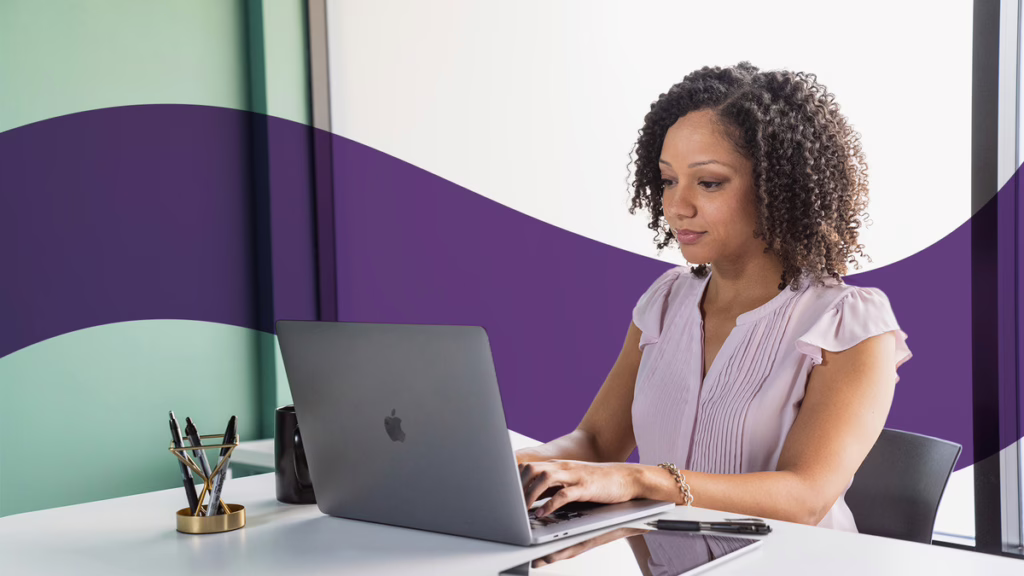 female employee typing in laptop