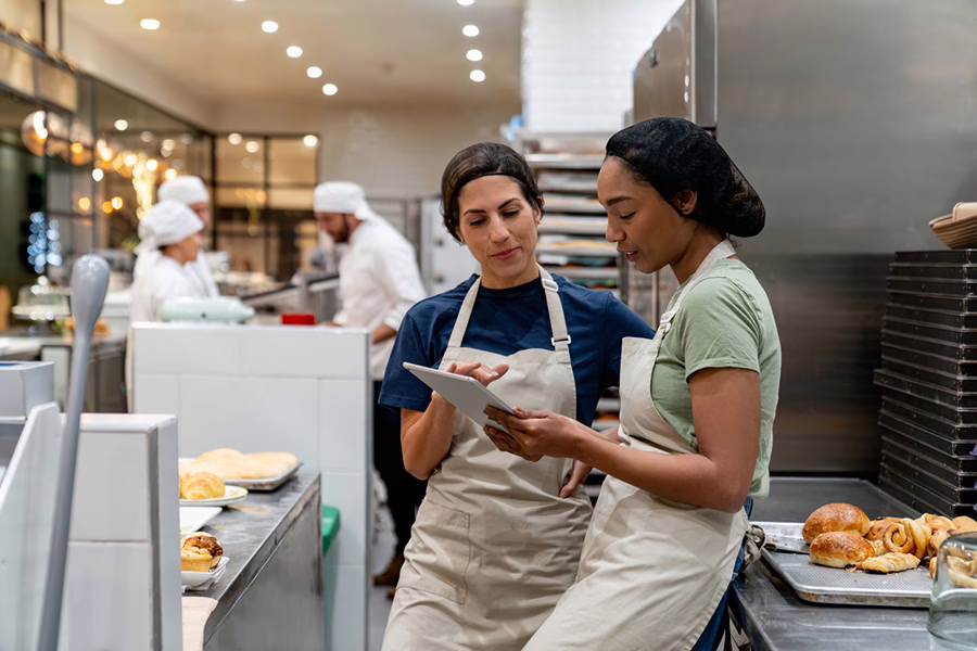 new employee being trained in cafeteria