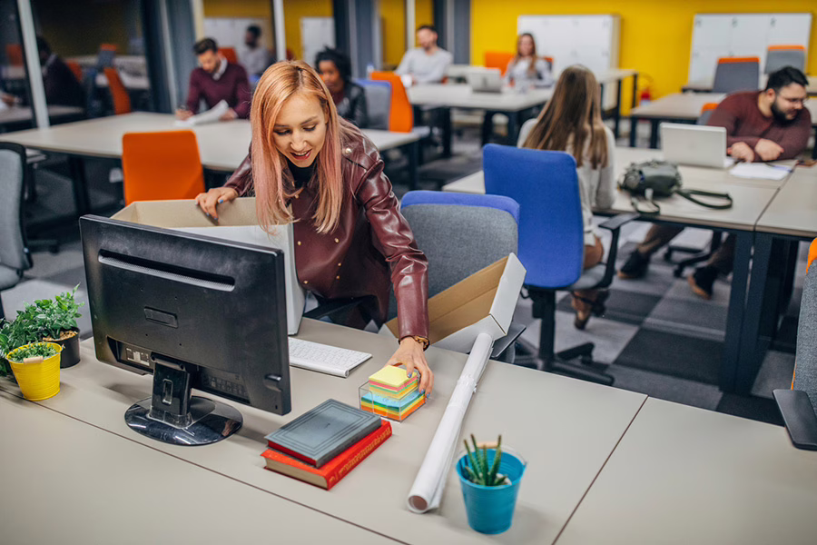 new employee setting up her desk