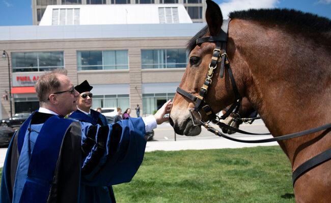 David Fithian, Clark's 10th Preside patting horses.