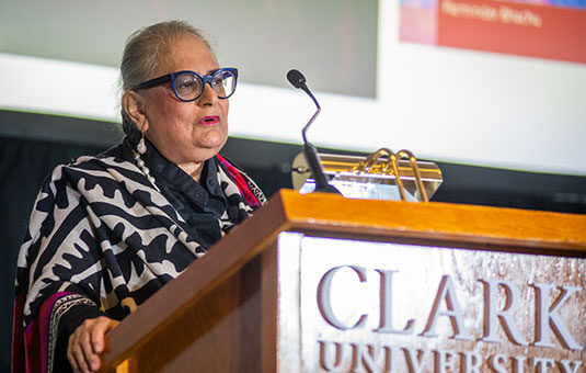 Professor speaking at lectern