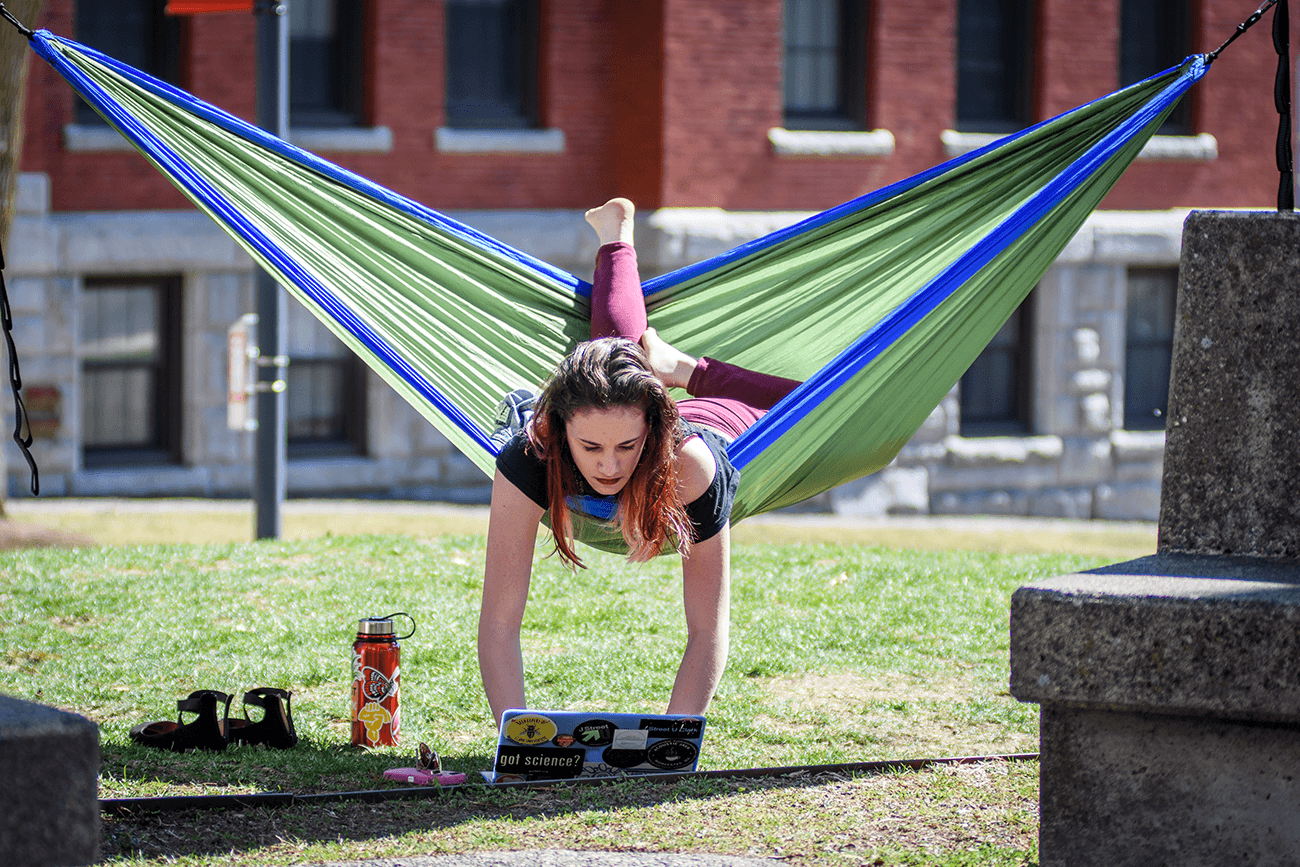 student in a hanging chair