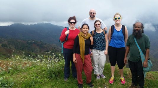 Christopher Owens (in white shirt, back row) with fellow graduate students and their professor, Jude Fernando (far right), in Haiti.