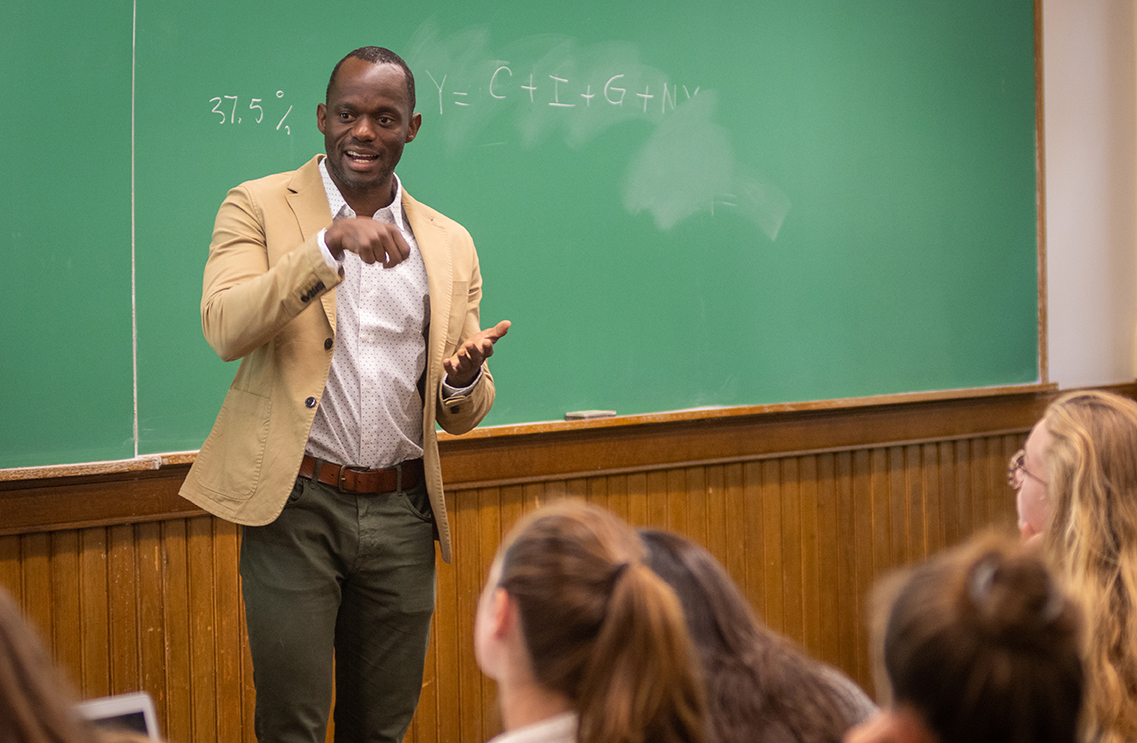 Edouard Wemy teaching an economics class