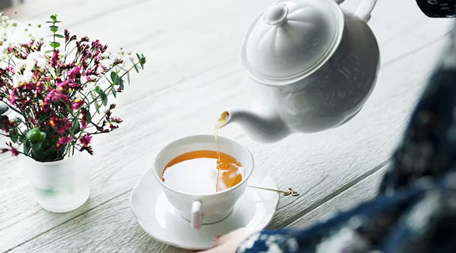 tea being poured into cup