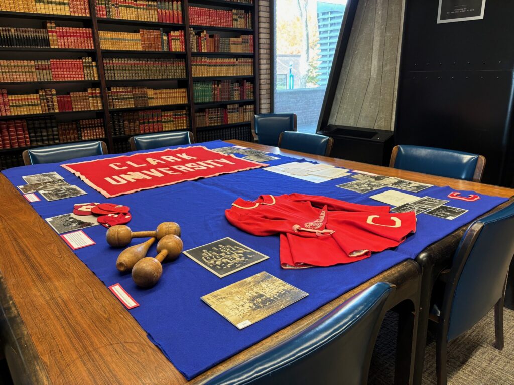 "Vintage Clark" display in the Archives and Special Collections Reading Room. featuring photographs, banners and an original cheerleaders uniform