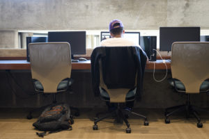 students at desks in library