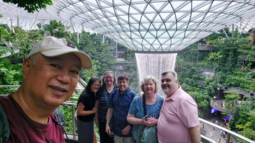 Clarkies Sandy Halim, MBA ’96; Unchalee (Kansaksiri) Krongboonying, MBA ’96; Deborah Abbott, MBA ’95, David Abbott, Lisa Lovely ’85, and Edward Pizzuto at the Jewel Rain Vortex in Singapore.