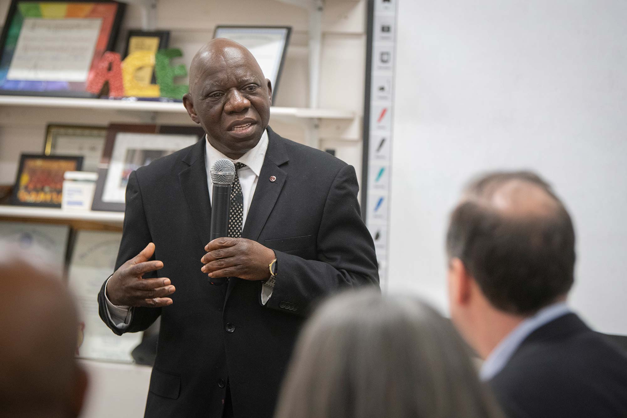 Kaska Yawo, executive director of ACE, speaks at the ceremony celebrating his orgnization's partnership with Clark.