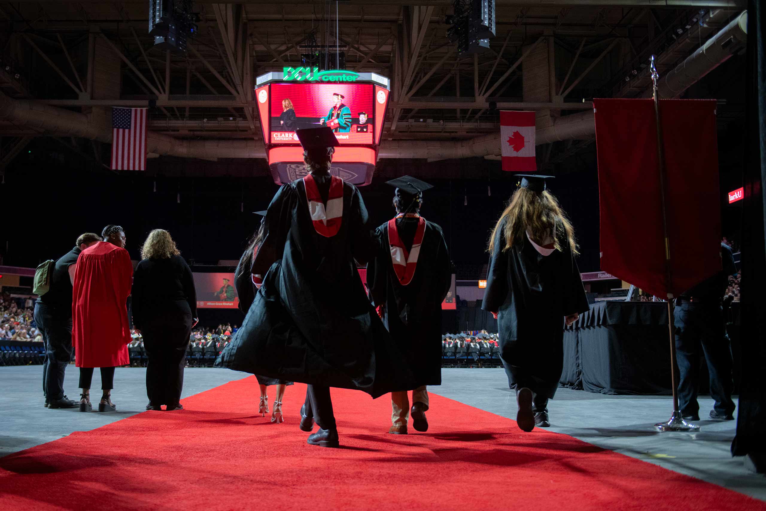 Students, seen from behind process in during Commencement.exercises