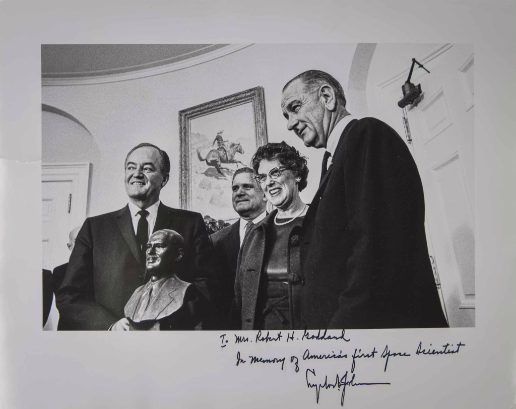 Esther Goddard in the Oval Office with Lyndon B. Johnson receiving a bronze portrait bust of Robert H. Goddard