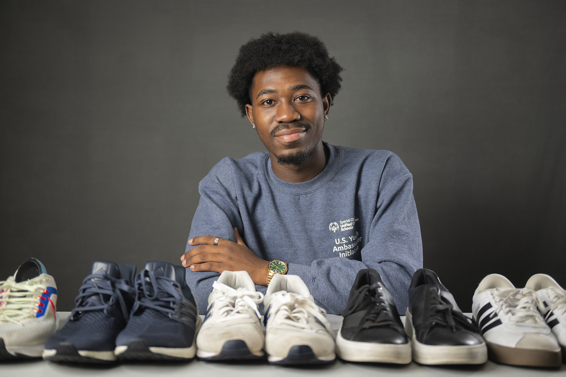 Jordan Adeyemi with donated athletic shoes