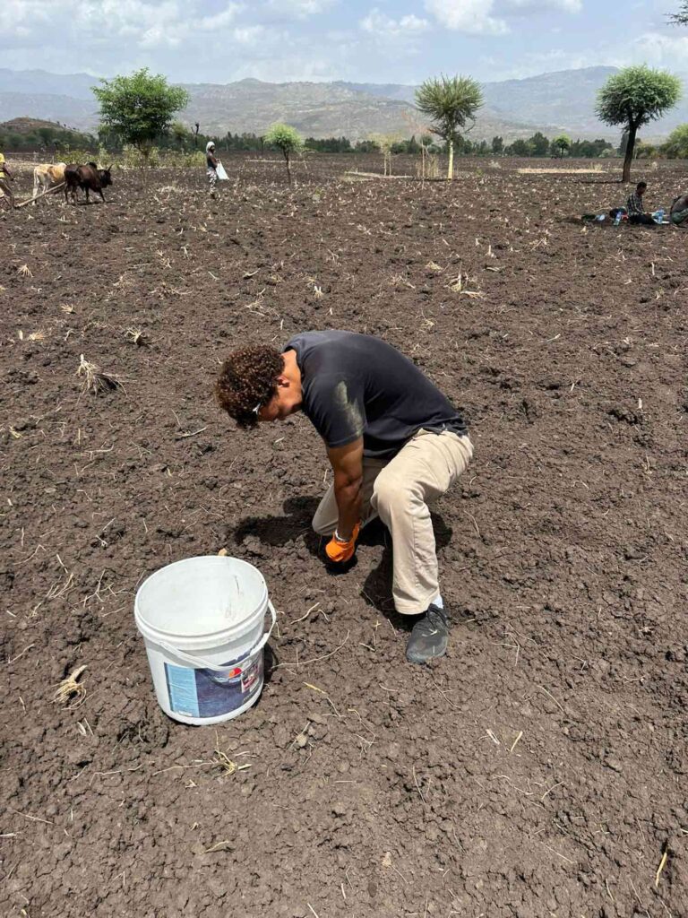 Marshall Fredericksen, M.S.-ES&P ’26 works a field in Ethiopia.
