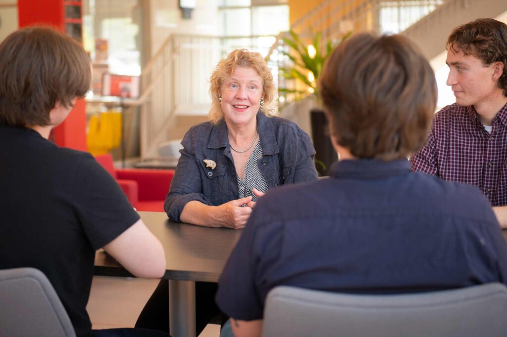 Melissa Hoffer, Chief Climate Officer for Massachusetts, chats with students from Clark’s HERO program.