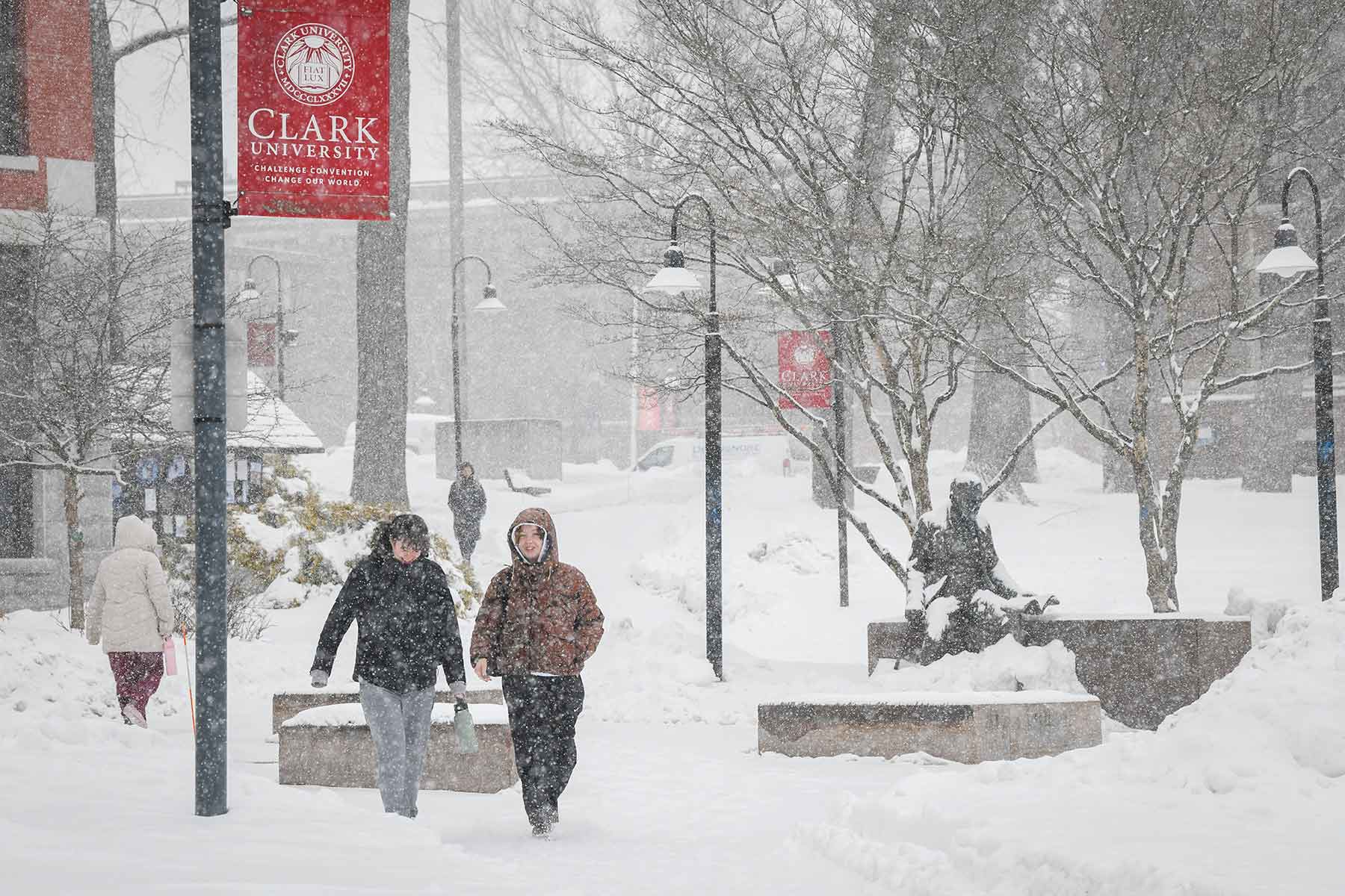 Students out walking on the Clark University campus during a record snowfall.