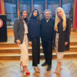 Stuart Weitzman stands with students during a visit to Clark University