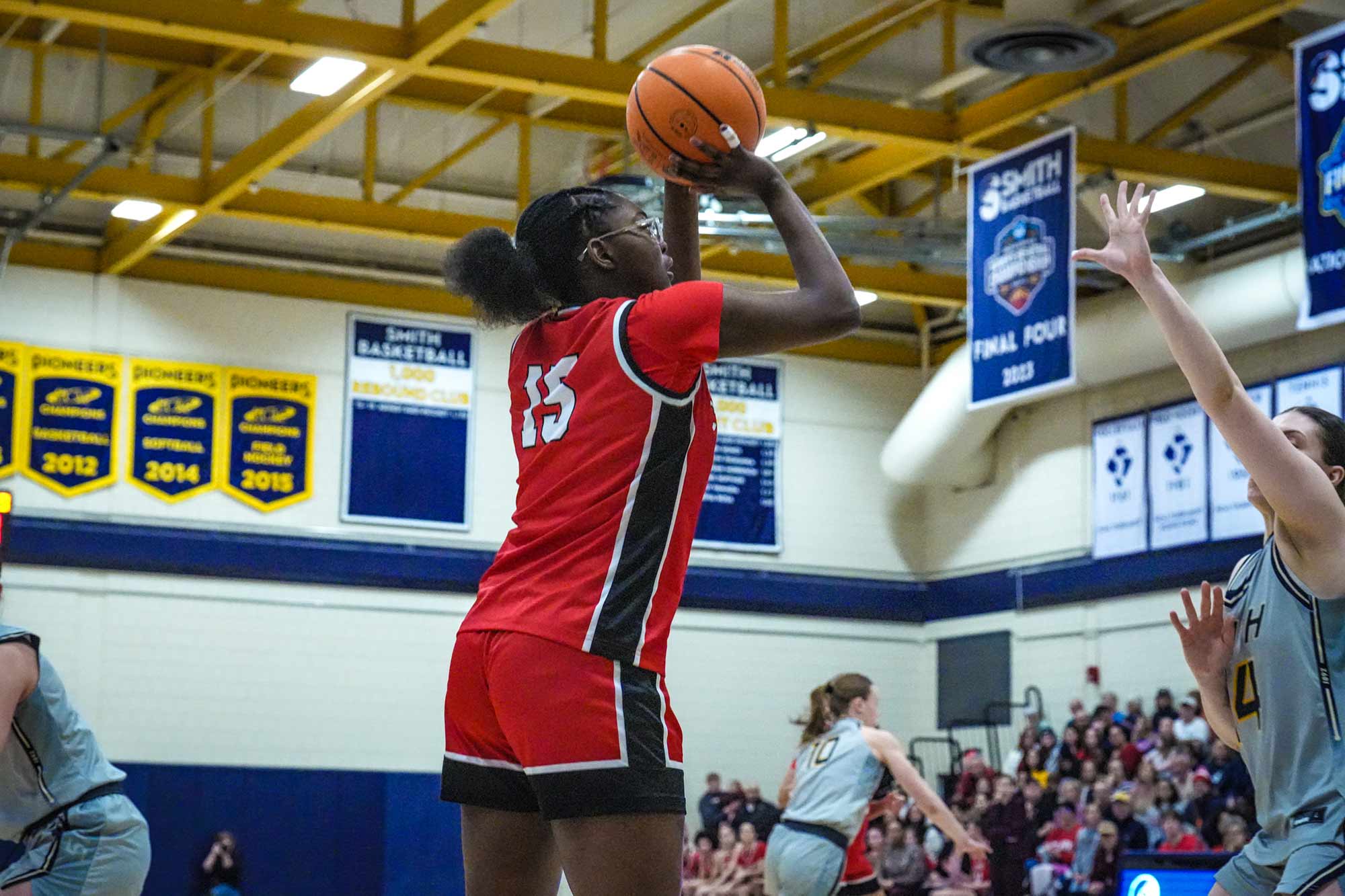 NEWMAC champion women's basketball team member going up for a layup, 2026