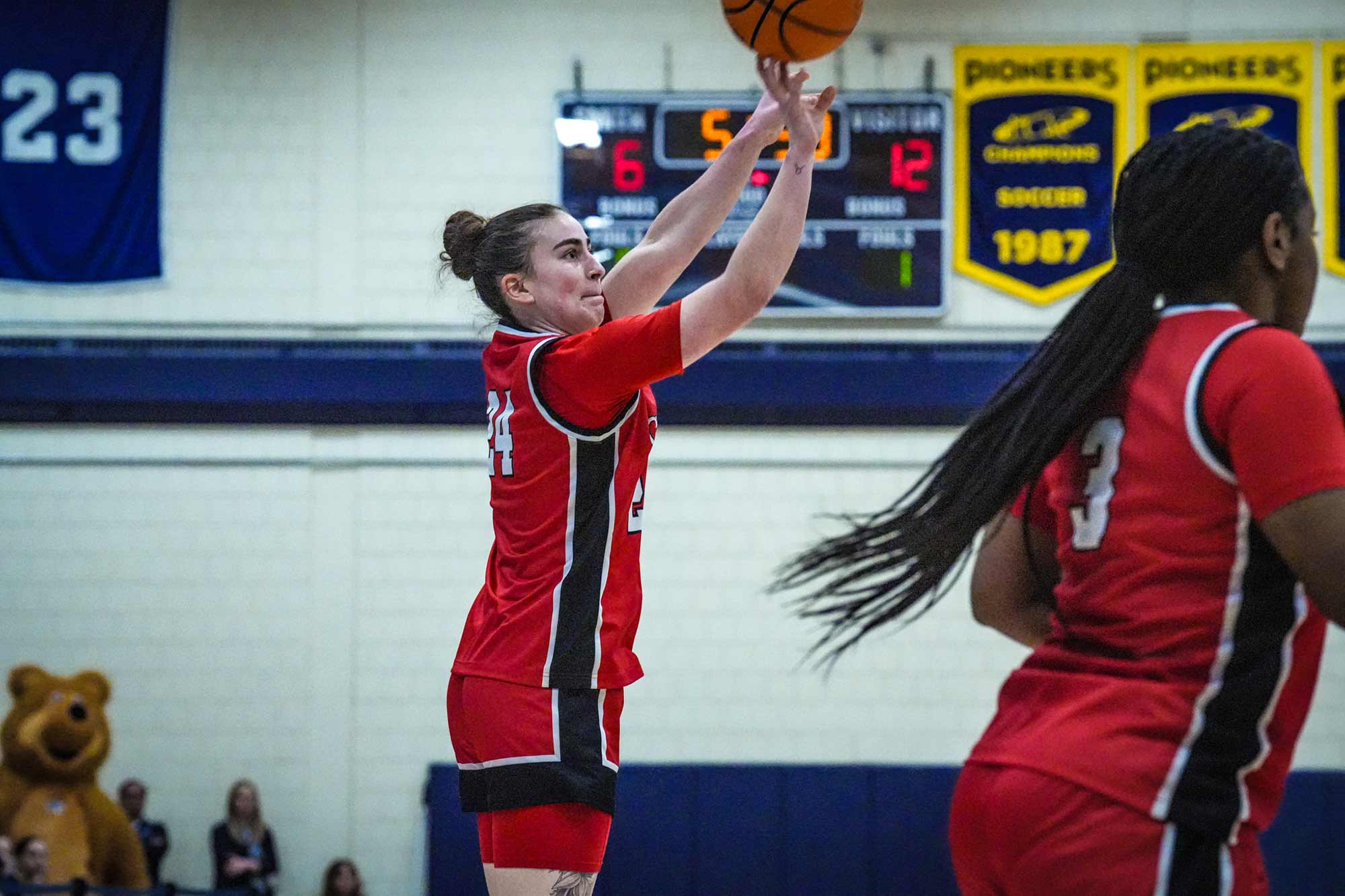 NEWMAC champion women's basketball team member going up for a layup, 2026