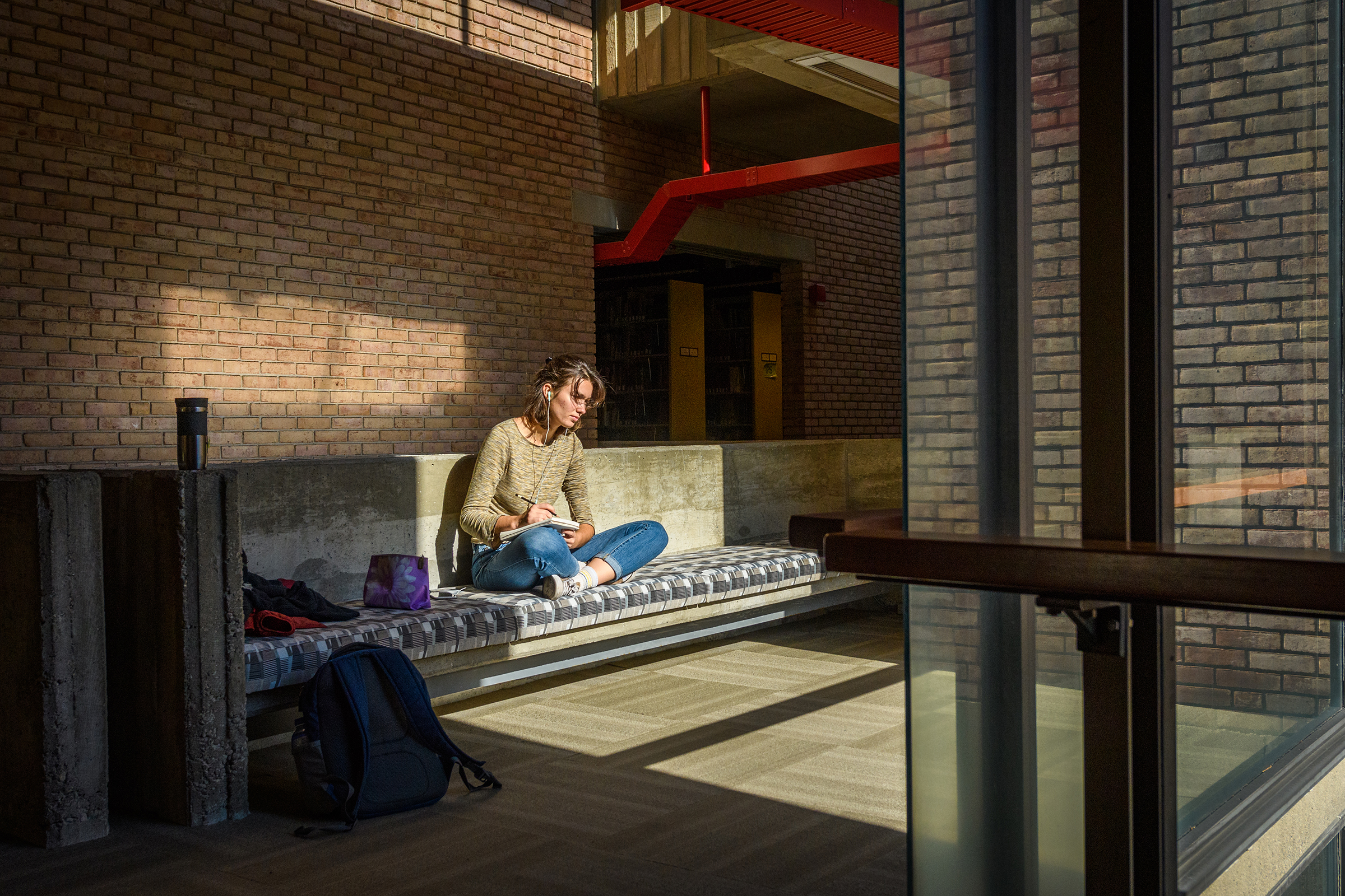 Goddard Library - girl sitting on oversized couch 