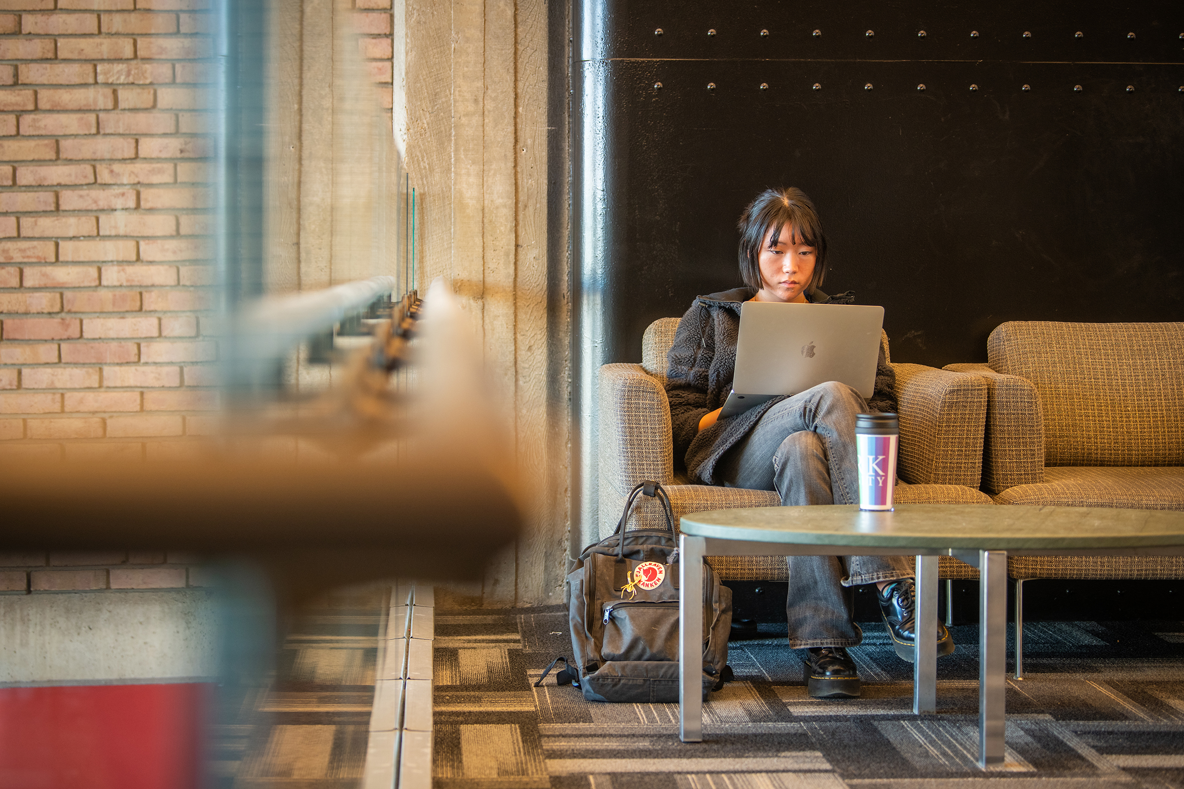 Goddard Library -  female student sitting with laptop