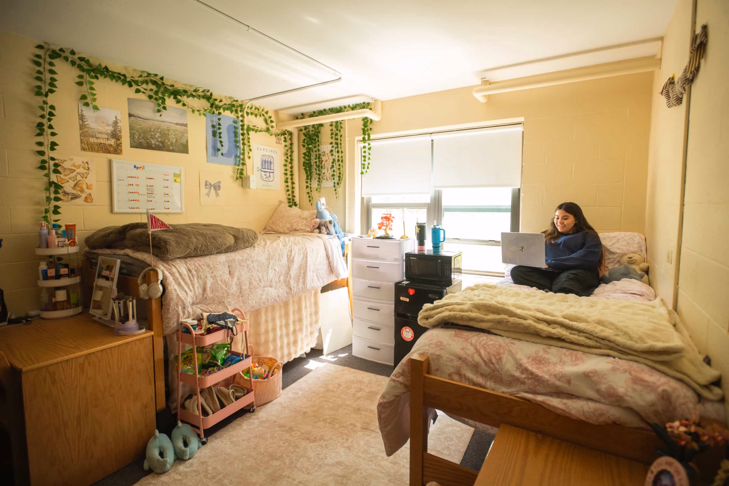 a student studies in her room