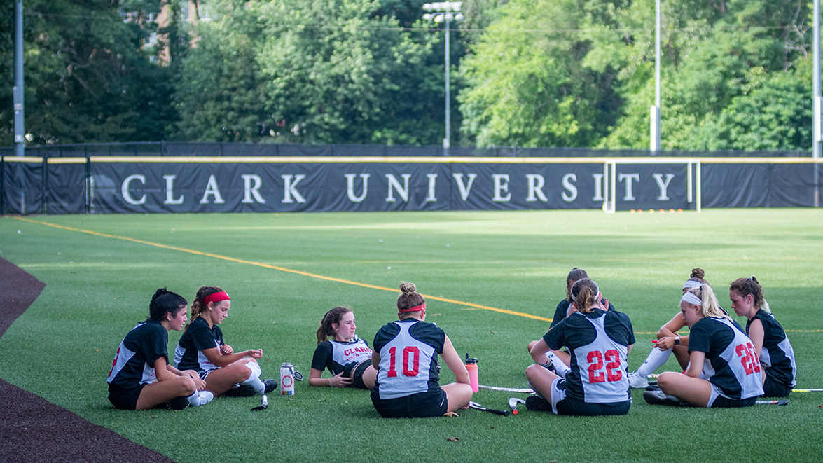 Dolan Field House - baseball players in the field sitting down (girls)