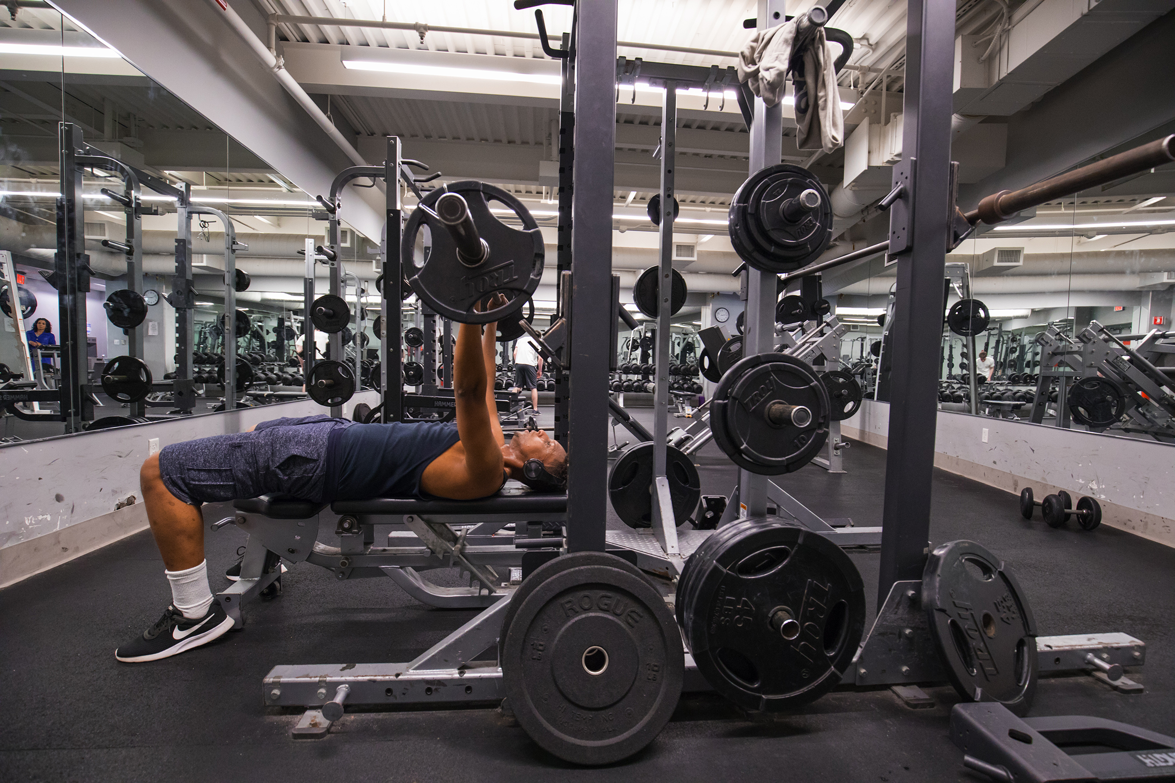 Kneller Athletic Center - male student working out in gym