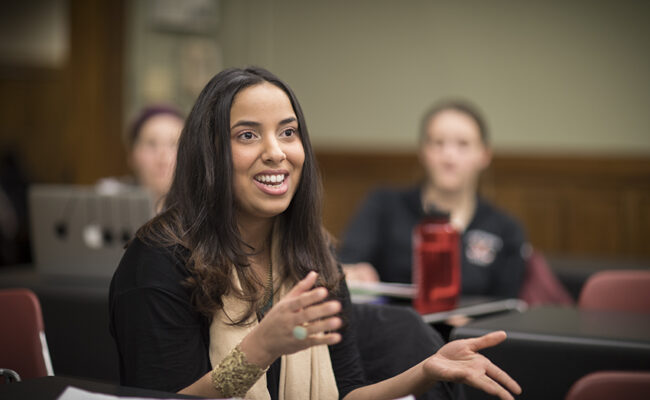 International Development, Community and Environment House - graduate student talking in class